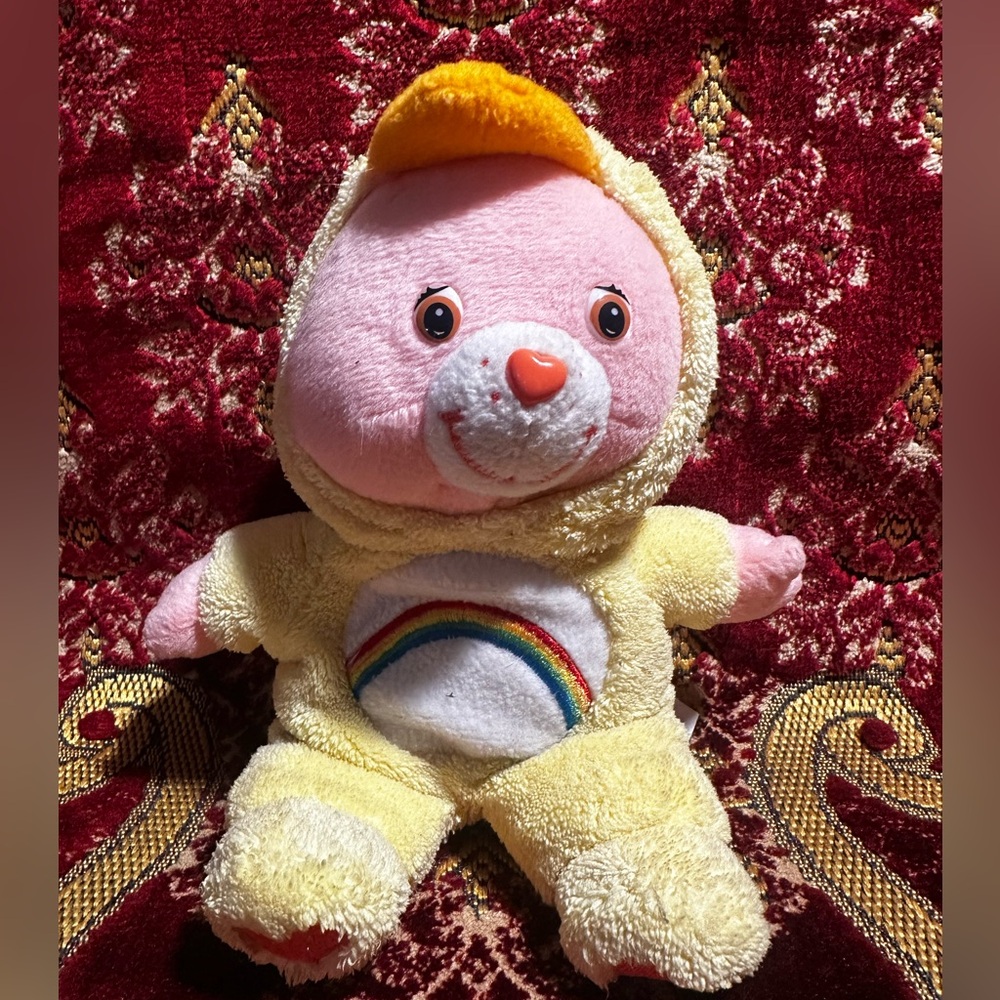 Care bear cheer bear. 
hi everyone hope you smiled a‎ little